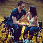 Couple both in wheelchairs in love.